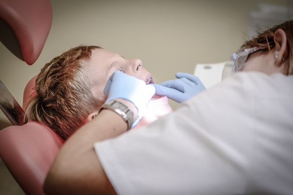 boy check up dental care 52527